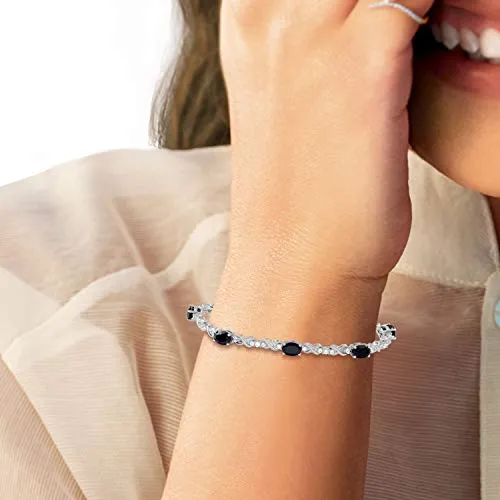 Jewelili Sterling Silver with 7 x 5 mm Oval Shape Onyx and Created White Sapphire Bracelet, 7.25"